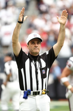 Referee calling a touchdown during football game