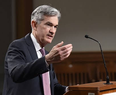 Jerome Powell speaking at a podium