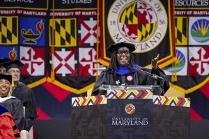 Dean speaking at a college graduation.