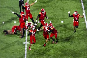 Football players celebrating on a field