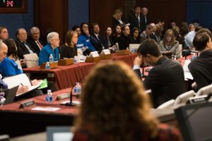 Seated speakers at a congressional hearing.