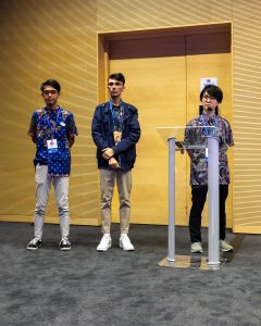 Student speaking at a lectern.