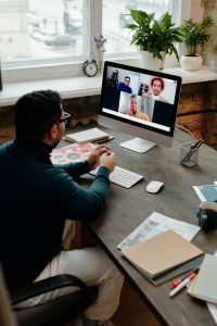 Man in Blue Long Sleeve Shirt doing Video Call