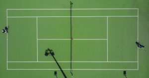Overhead shot of a tennis court.
