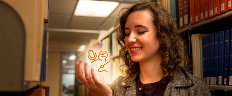 A woman looking into their hand imaginatively holding graphics of a microphone, ink-writing, and a human head figure